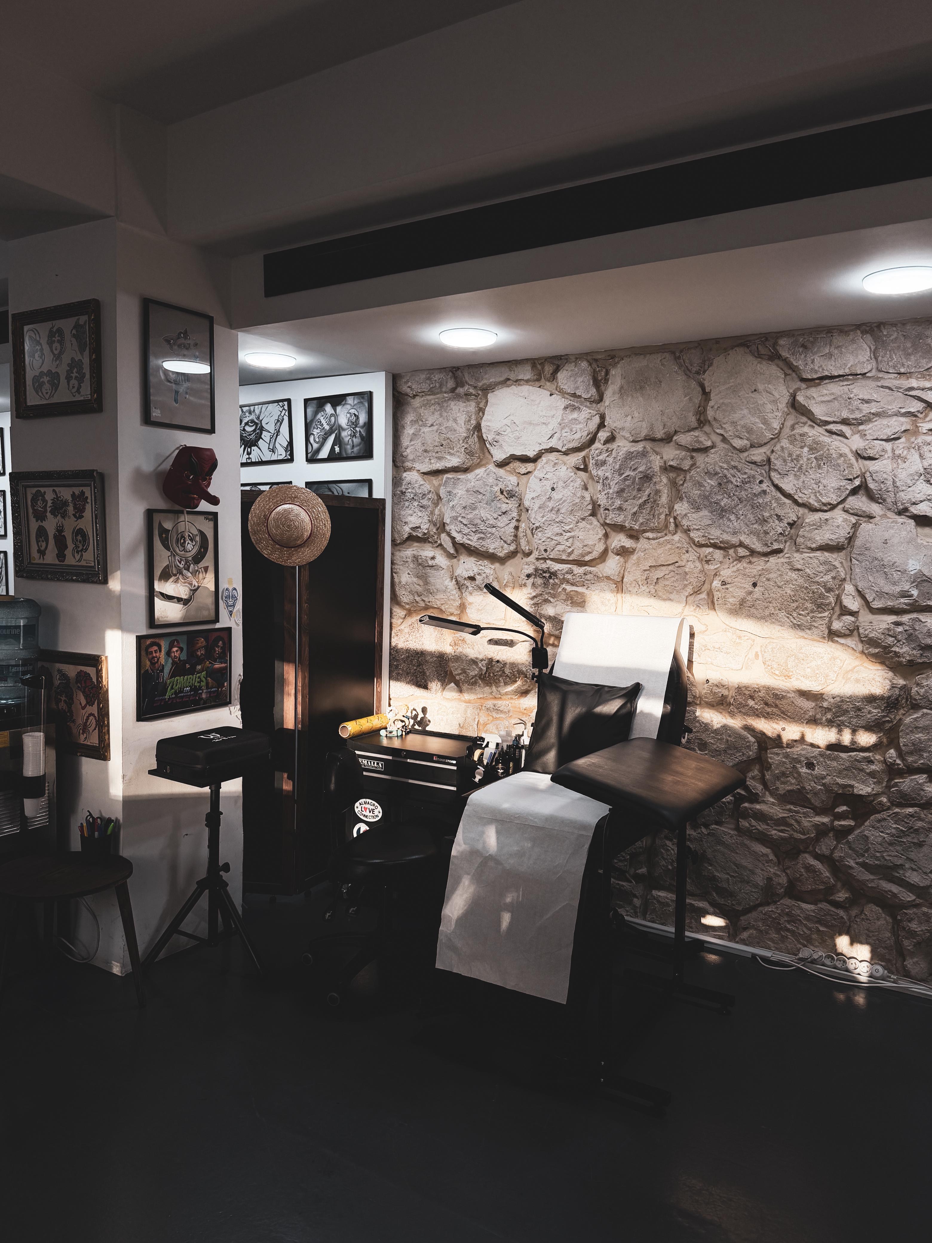 Tattoo station against original Lebanese stone wall