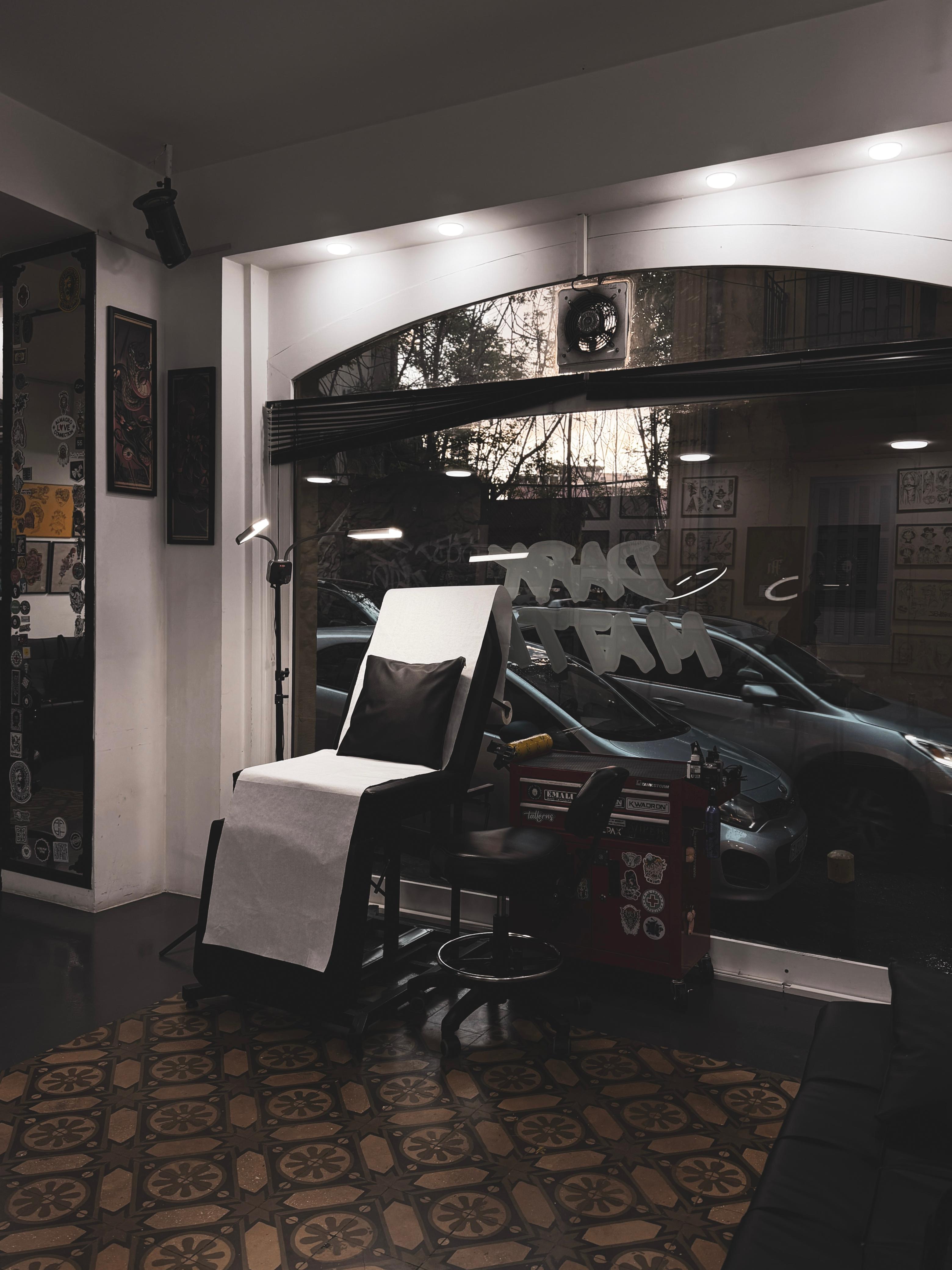 Tattoo station with Dark Matter signage on the window